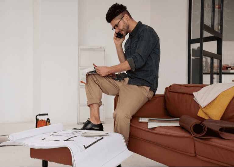 Interior designer on a work call in his office