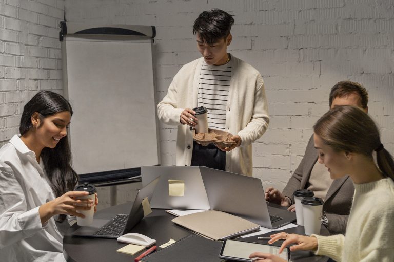 Brand strategist and his team working at an office