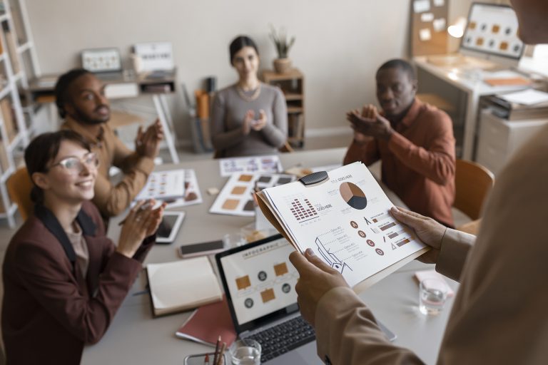 Design consultant presenting to a room full of people